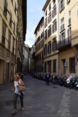 Italian Woman Walking in a Street in Florence near Piazza Santa Croce.jpg