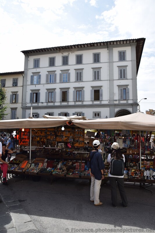 Merchant stands selling goods near Florence Central Market.jpg