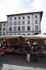 Merchant stands selling goods near Florence Central Market.jpg