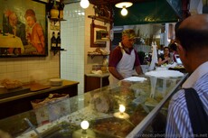 Chef works on a meat sandwich at Da Nerbone in Mercato Centrale Florence.jpg