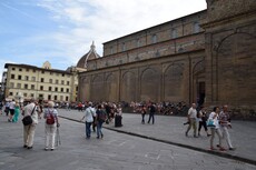 Tourists resting on the steps of Basilica of San Lorenzo.jpg
