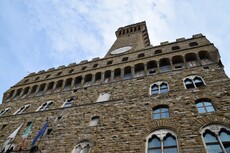 Looking up at Palazzo Vecchio & Its Tower.jpg